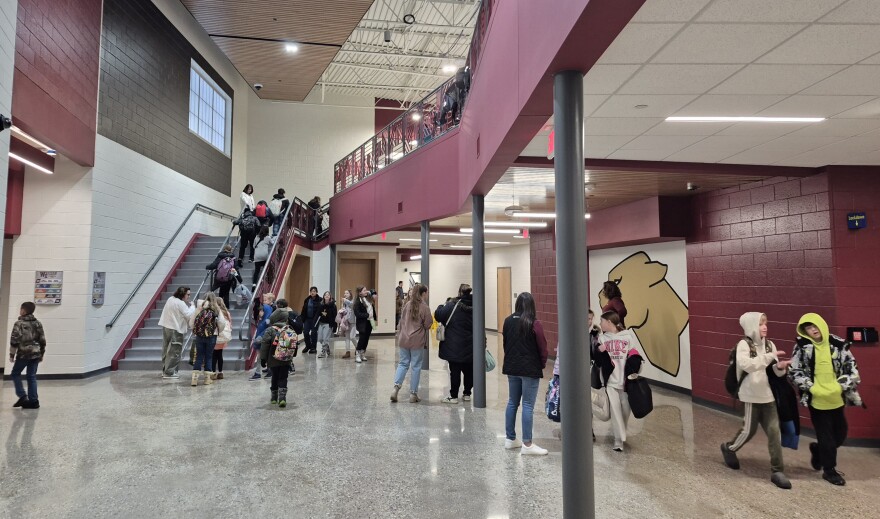 Some Western Elementary School students walk to their classrooms early Tuesday morning.