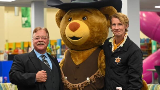 Joe Wiegand, Medora mascot Sheriff Bear, and Tom Brosseau | Prairie Public