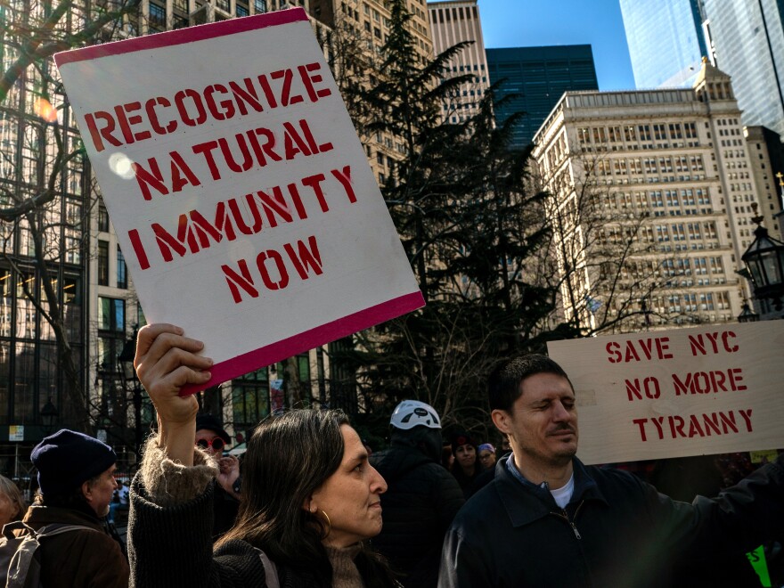 People gather at City Hall to protest New York City's vaccine mandate for public employees on February 11, 2022, the day that many were fired.