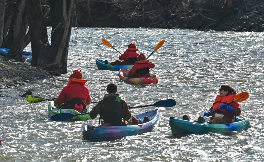 Kayakers on the Lackawanna River in Scranton paddle into Sweeney's Beach.