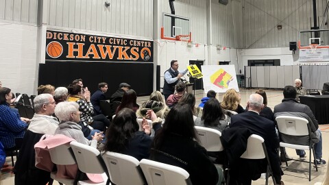Lackawanna County Controller Gary Dibileo holds up a "No Data Center" sign during a special meeting of the Dickson City Borough Council.