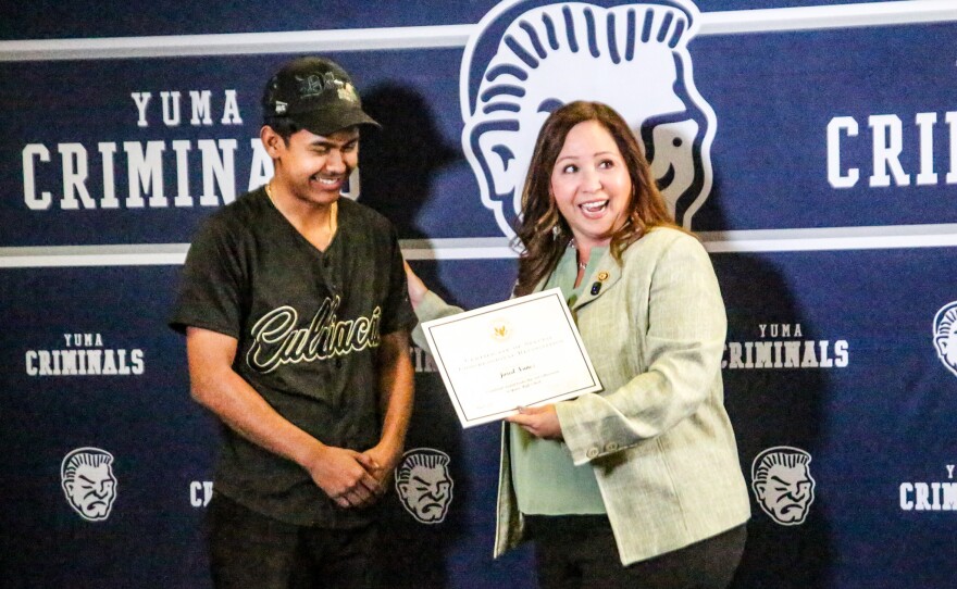 Before posing for a photo, Adelita Grijalva asked Jared Nuñez about his plans for school. S