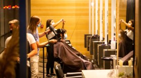 Stylists do customers' hair at Milk + Honey Spa. 