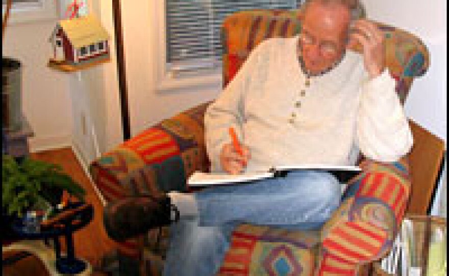 Kooser writes in his living room. "I just sit there under the floor lamp early in the morning and work and see what happens," he says.