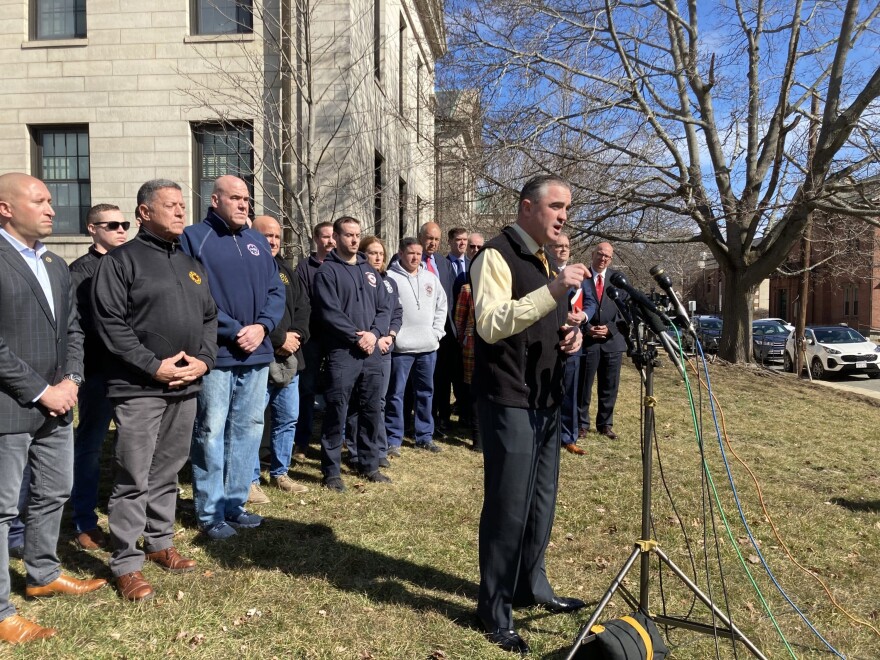 International Association of Fire Fighters President Edward Kelly speaks outside Norfolk County Superior Court in Dedham. (Gabrielle Emanuel/WBUR)