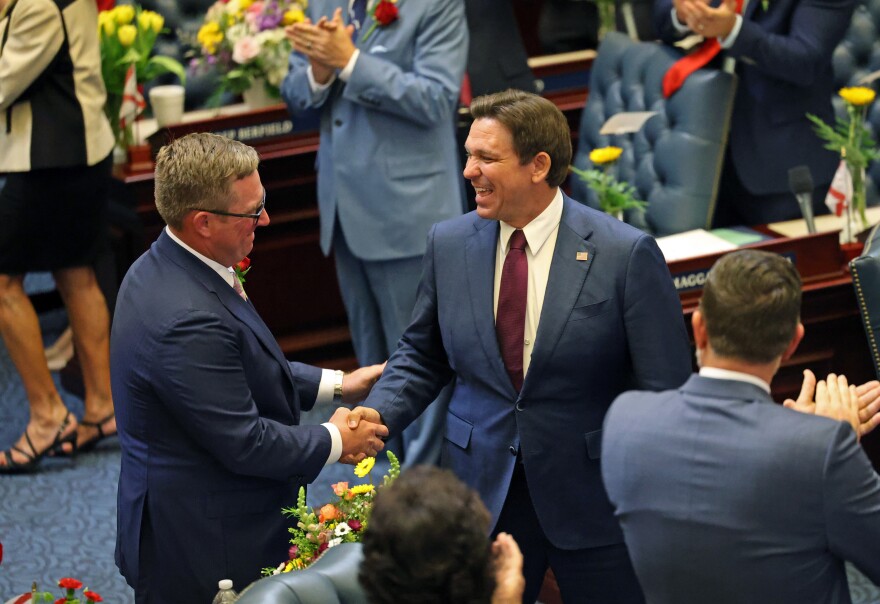 Gov. Ron DeSantis shakes representatives and senators hands as he enters the Florida House of Representatives to give the State of the State Address in Tallahassee, Fla., on Tuesday, March 4, 2025. (Libby Clifton/Fresh Take Florida)