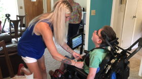 Decatur resident Brandy O'Connor at home with her son, Mark Bolen, 10. Mark has cerebral palsy and O'Connor said she has struggled to find a childcare facility willing and able to care for him.