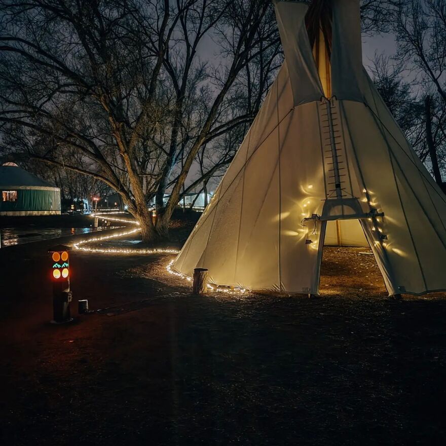 Yurts and tipis at the Outer Range campus were illuminated on December 9, 2021