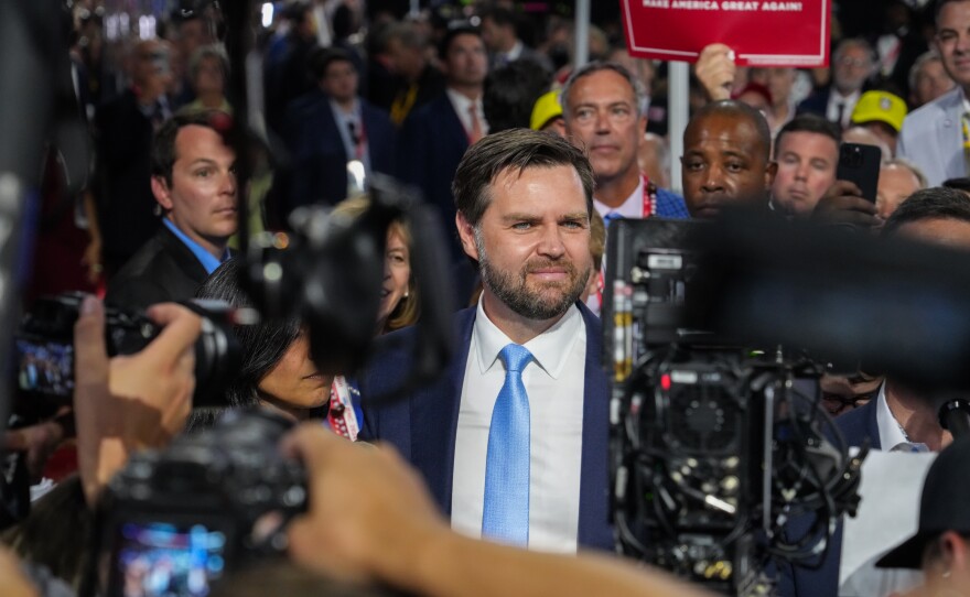 Republican vice presidential nominee, J.D. Vance, stands on the floor next to the Ohio delegates at the 2024 Republican National Convention.