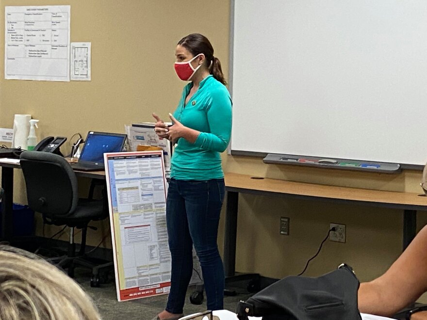 Congresswoman Abby Finkenauer receives a briefing on derecho damage in Benton County.