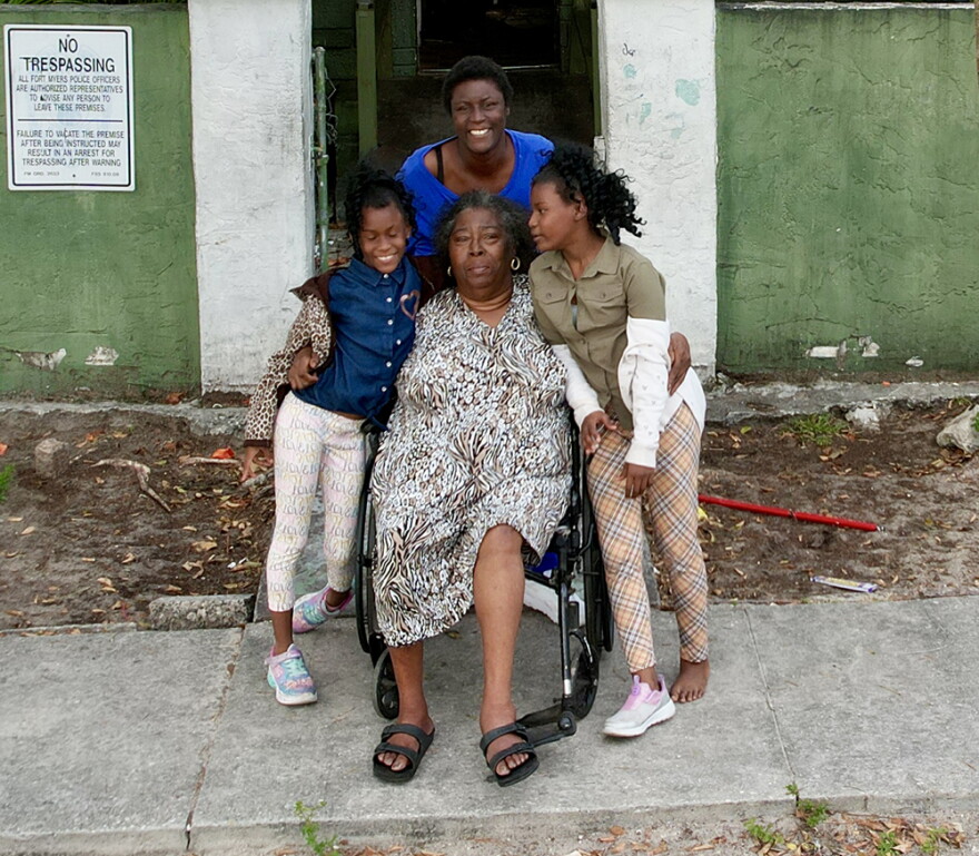 Fort Myers resident Myrtle Dillard with daughter and grandchildren. The Dillars were gifted a new home Tuesday in a special local builder's event.
