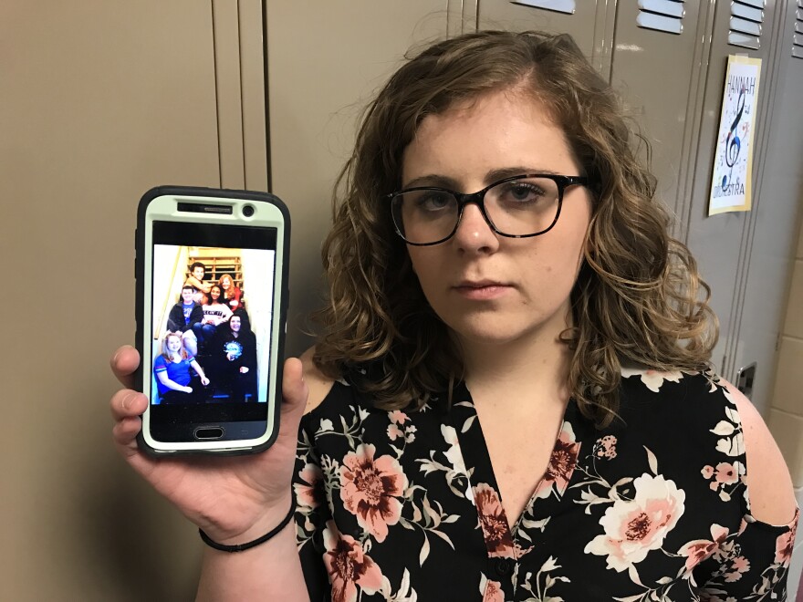 Spring Hill High School senior Bella Price keeps a photo of her friend Josh Hoston (top left), who killed himself three years ago. She's now working with other students to try to address the rise in teen suicides in Johnson County, Kansas. 