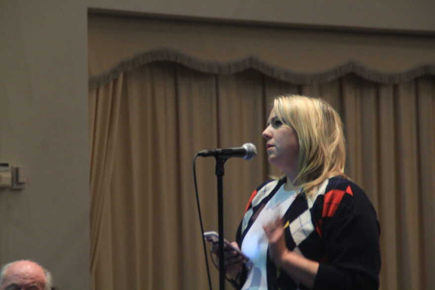  A woman provides her comment during a special hearing. 