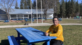 Danny Brigman sitting outside at the Wellpinit Powwow Grounds.