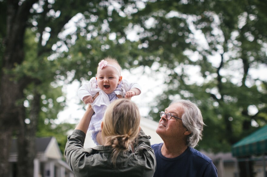 Writer Greg O'Brien and his daughter, Colleen, play with Adeline, Greg's 8-month-old granddaughter. Eight years ago, Greg was diagnosed with Alzheimer's disease.