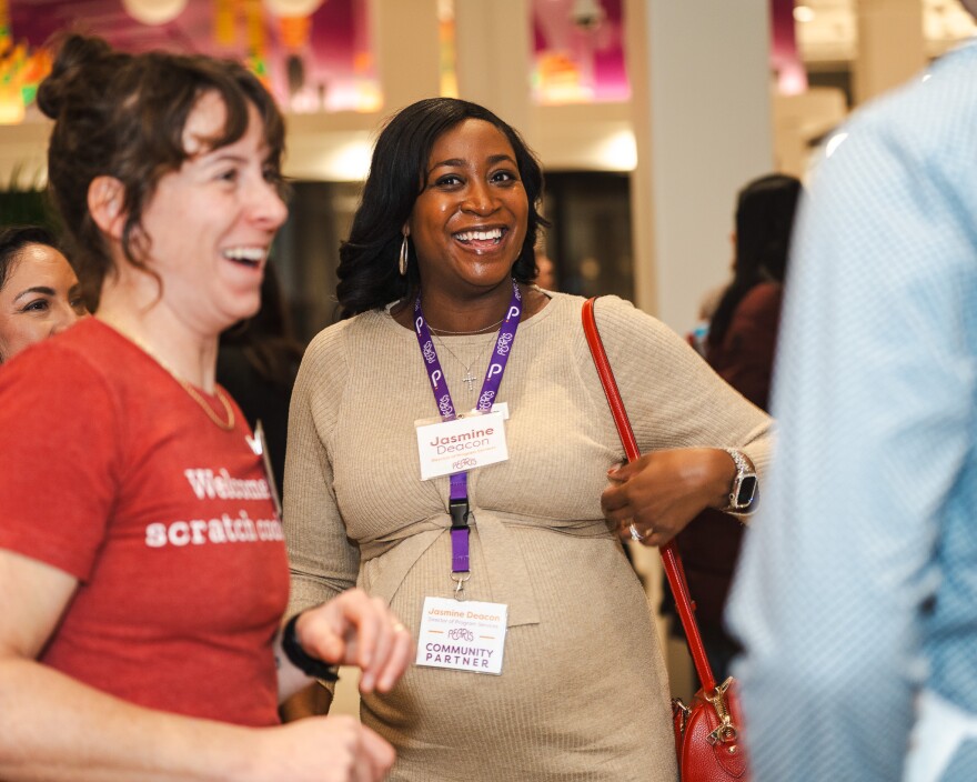 Caitlin Cullen (L) and Jasmine Deacon (C) chatted with others at the event.