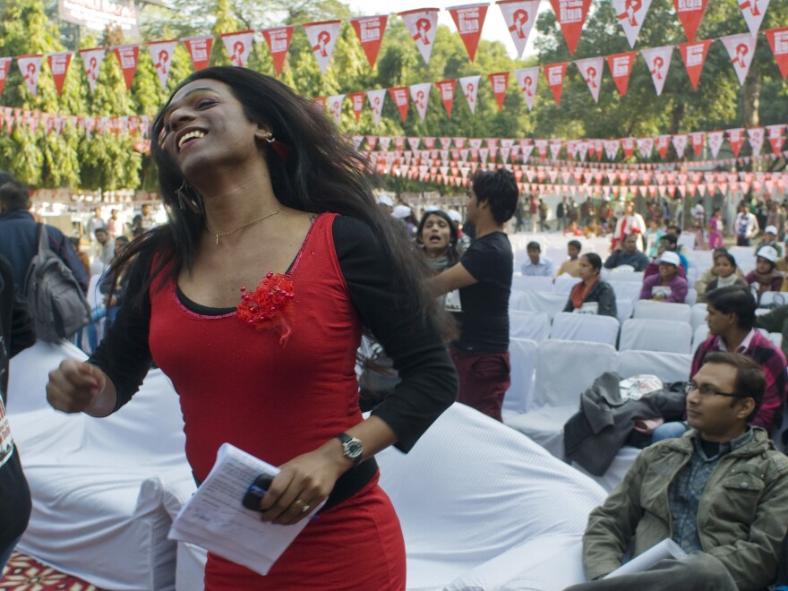 Aher dances during an event observing World AIDS Day in New Delhi on Dec. 2, 2012. Of the recent legal ruling, recognizing transgender Indians as a third gender, she says: "We have put a foot inside a door, which is a door of hope, and we will open it — very, very soon."