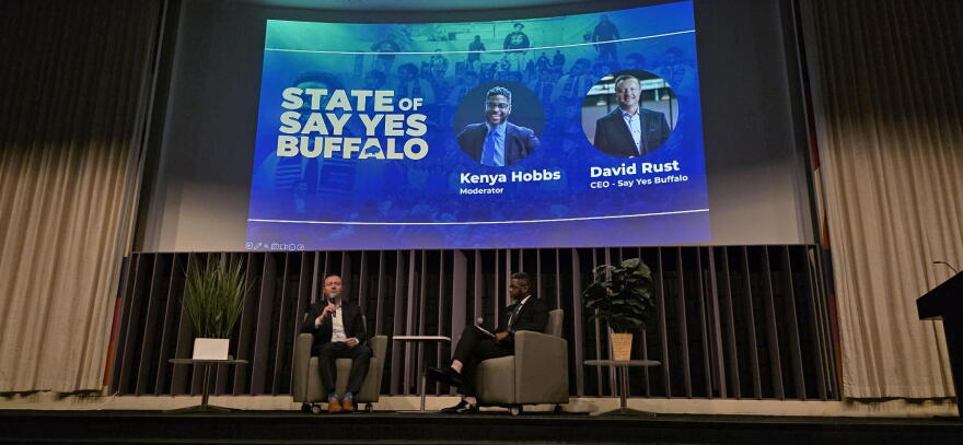 Say Yes Buffalo CEO David Rust (left) and board member Kenya Hobbs (right) speak during the inaugural State of Say Yes Buffalo address.