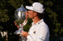 Michael Brennan kisses trophy after winning the Wyndham Championship