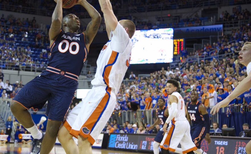 Auburn's Malcolm Canada tries to draw contact on Florida's Jacob Kurtz during the act of shooting.