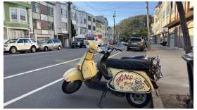 The famous 'Signs By Meng' scooter sits parked in the Inner Sunset.