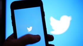 FILE - The Twitter application is seen on a digital device, April 25, 2022, in San Diego.  Elon Musk, the world's richest man and the owner of SpaceX and Tesla, says he is a free speech absolutist who doesn't support the kind of content moderation that saw people like ex-President Donald Trump get banned for inciting violence. (AP Photo/Gregory Bull, File)