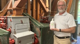 James Elkins, general manager at Big Spring Mill, holds a bag of freshly ground cornmeal.