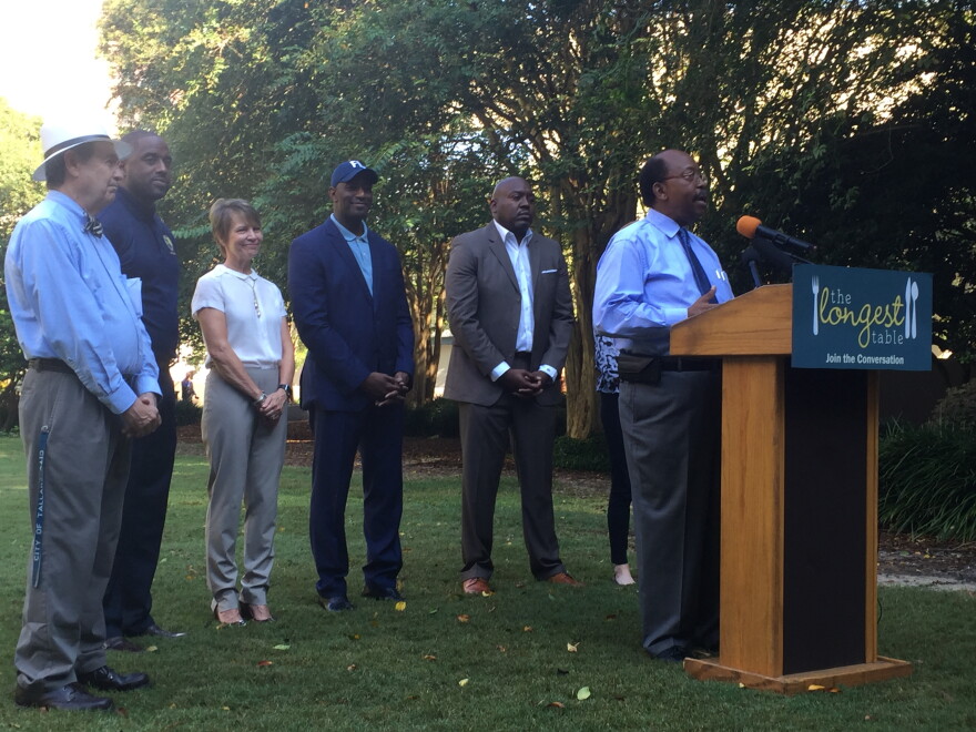 City Commissioner Curtis Richardson (right) speaks at an announcement for the upcoming Longest Table event, the fourth of its kind. 