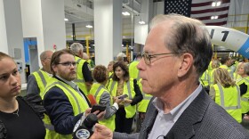 Governor Mike Braun speaks to reporters before touring a new Amazon fulfillment center in Elkhart County on Oct. 15.