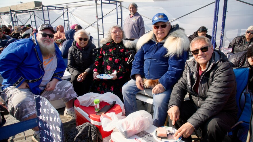 The Brower family enjoys muktuk during the 2025 Nalukataq in Utqiagvik.