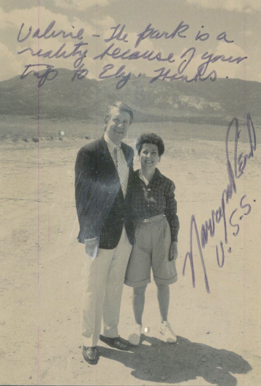 Valerie Wiener, who served as press secretary and speech writer for Congressman and Senator Harry Reid (D-Nevada) in Washington, D.C., celebrates the dedication of the Great Basin National Park with Senator Reid in 1986. The handwritten messages across the front of the image reads: "Valerie - the park is a reality because of your trip to Ely. Thanks. Harry M. Reid, U.S.S."