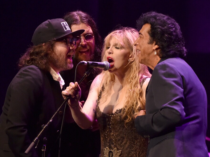 Musicians Kevin Drew, Damon Fox, Courtney Love and Andy Kim perform onstage during the 60th anniversary celebration of Allen Ginsberg's "Howl" Tuesday at the Ace Hotel in Los Angeles.