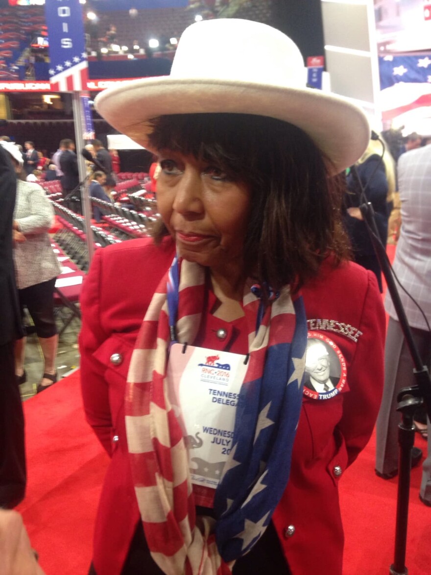 Charlotte Bergmann, a delegate from Tennessee, stands in the Quicken Loans Arena in Cleveland during the Republican National Convention. (Peter O'Dowd/Here & Now)