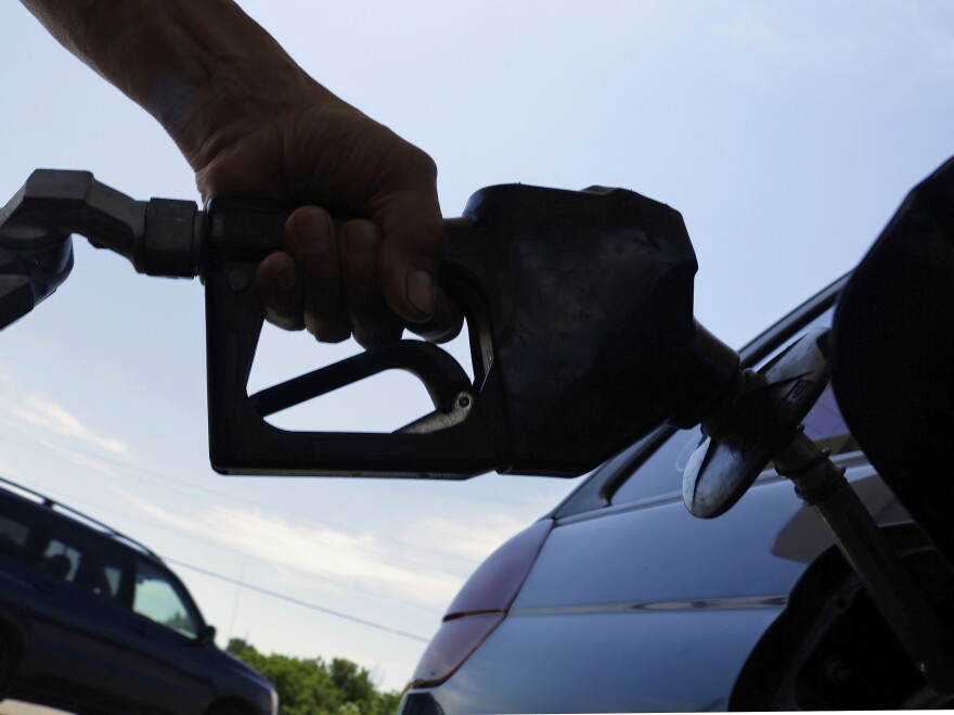 A motorist fuels up at a service station in Springfield, Ill.