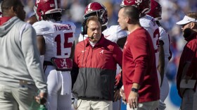 Alabama head coach Nick Saban stands in a huddle during the first half of an NCAA college football game in Lexington, Ky., Saturday, Nov. 11, 2023. (AP Photo/Michelle Haas Hutchins)