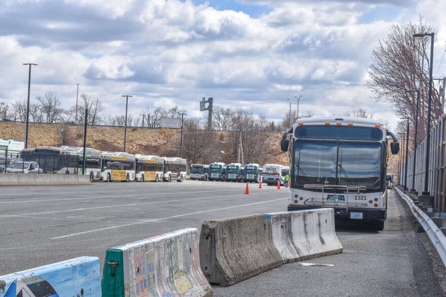 A fleet of Rhode Island Public Transit Authority buses is parked across the street from the agency’s Providence headquarters on Melrose Street.