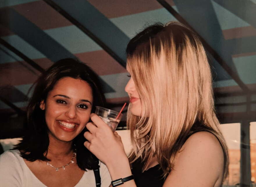 Two young women, smiling at a school event