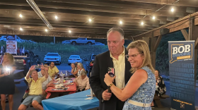 Wills Pike, the master of ceremonies at the Montville Republican Town Committee barbecue, and Leora Levy, who is aspiring to the Republican nomination to take on U.S. Sen. Richard Blumenthal, listen as Donald Trump speaks on Levy's phone.