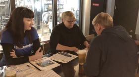 Rachael Belz, Ohio Citizen Action, collects signatures for the HB6 Referendum at Land Grant Brewery. This was one of several public events the referendum group held to collect signatures.