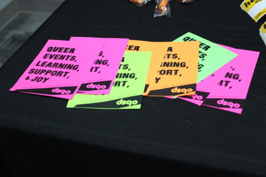Flyers for the Dallas Social Queer Organization at a panel event in Irving, March 25, 2026.