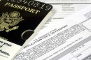 A sample passport atop an application for a US passport.