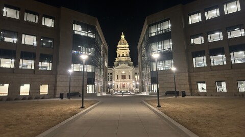 The Wyoming Capitol building at night.