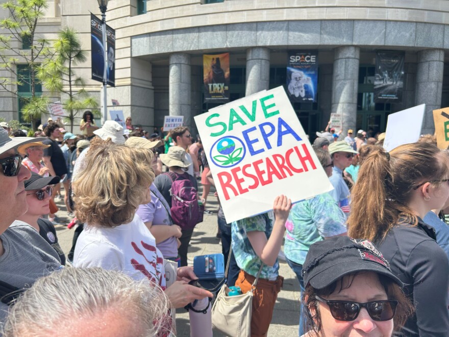 A sign held by Leah Fowler, who left her job as a probationary worker at the Environmental Protection Agency's Office of Research and Development last week, which has a major campus in Research Triangle Park. Fowler said she left as it became clear her position was in jeopardy after plans for major cuts to the EPA were announced by the Trump Administration. Fowler said she remains committed to the EPA's mission and is worried about the impact the proposed cuts could have. "We're not going to able to do the science that is detecting all of the harmful things that we want to try to remove from the environment," Fowler warned, referring how the cuts could interrupt critical studies on PFAS, so-called forever chemicals that have polluted rivers in North Carolina and other areas, as well as the effects of lead, arsenic, and microplastic contamination.