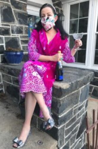 Dyana Neal in a pink robe and mask