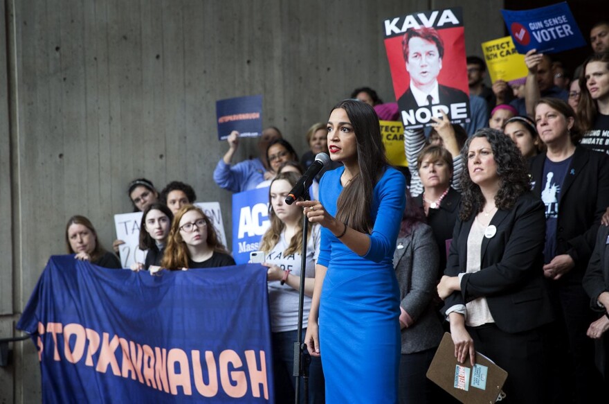 Alexandria Ocasio-Cortez addresses protesters in Boston's City Hall Plaza. (Robin Lubbock/WBUR)