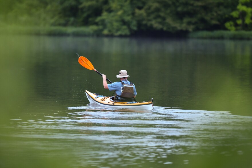 Mark Hein paddles out on Shawnee Mission Lake Friday morning.