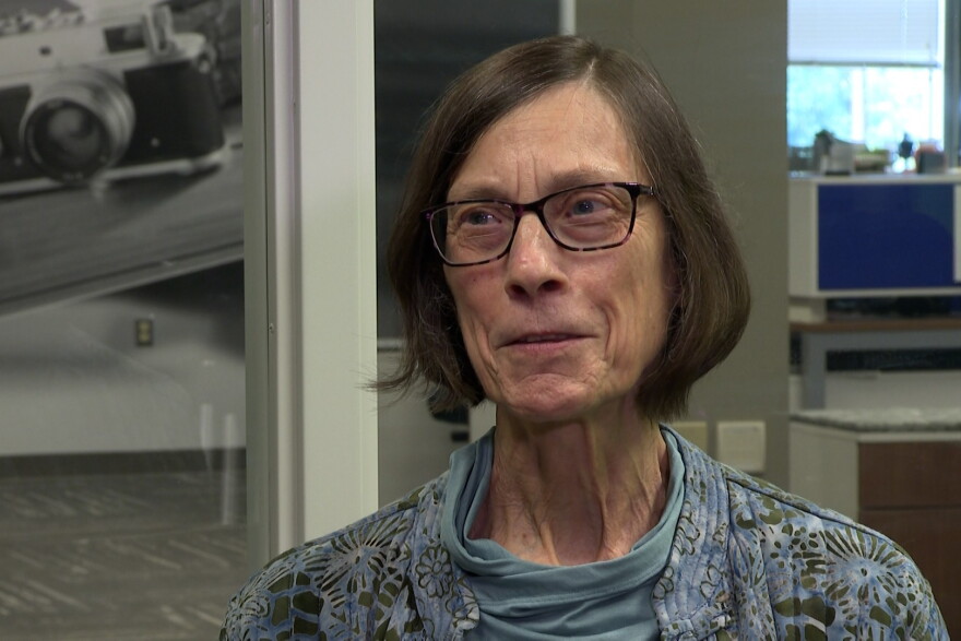A woman with glasses and a bob haircut