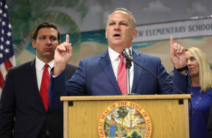 Florida Education Commissioner Richard Corcoran speaks during a press conference at Bayview Elementary School in Fort Lauderdale as Gov. Ron DeSantis stands nearby.