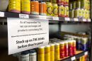 A St. Louis liquor store hung a sign announcing Gov. Mike Parson’s executive order to ban intoxicating hemp beverages. The sign reads, "As of September 1st, we can no longer sell products containing THC. Missouri has now banned the sale of food and beverages containing THC. Stock up on THC drinks before they're gone!" The sign is posted above a grocery store-style shelf holding THC drinks by various brands.