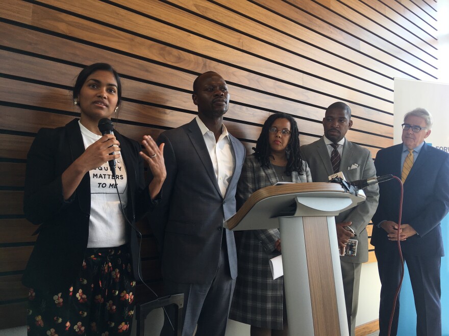 Members of the Forward Through Ferguson press conference present the findings of the most recent report. Left to right, Karishma Furtado, Yinka Faleti, Trina Dyan Clark James, Rev. Starsky Wilson and Rich McClure.